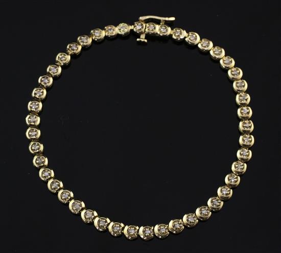 A 9ct gold and diamond tennis bracelet, 7.5in.